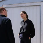 Client Executive, Lea Jensen, taler med investor til kvartalsarrangement